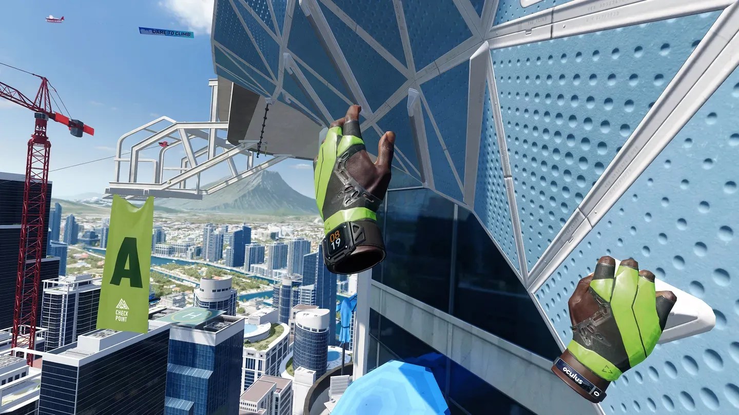 The Climb 2 Meta Quest player gripping skyscraper handholds high above a city