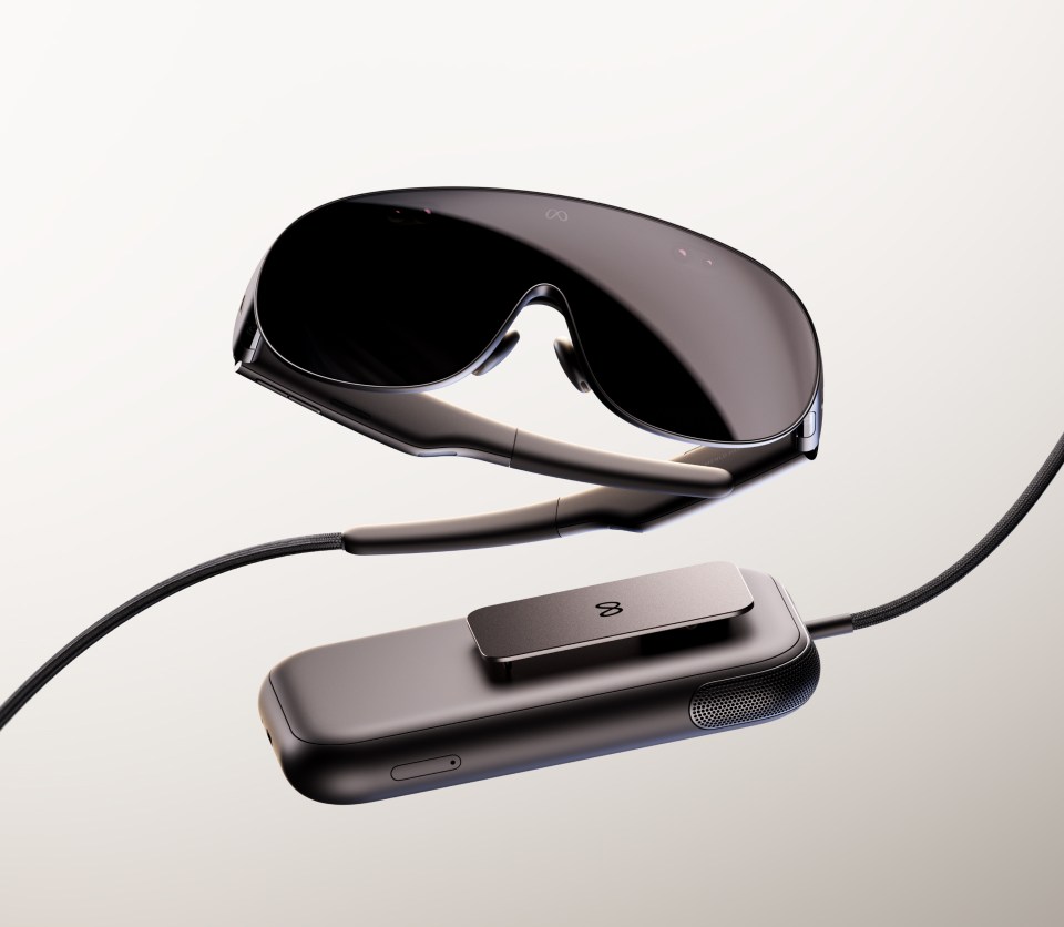Meta VR Glasses beside their tethered compute and battery puck